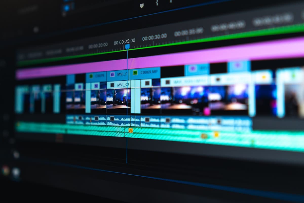 Creative workstation with video editing and music production representing Apple Creator Studio