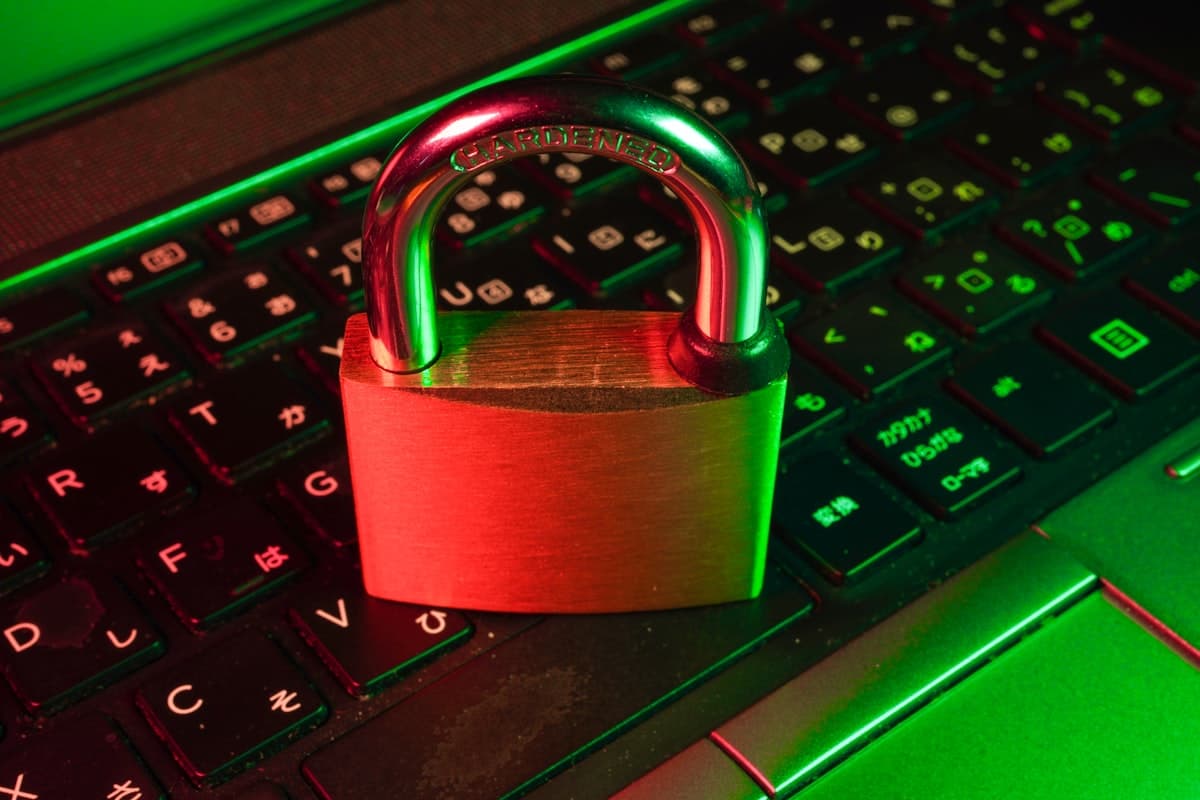 Digital padlock over binary code representing cybersecurity and data protection