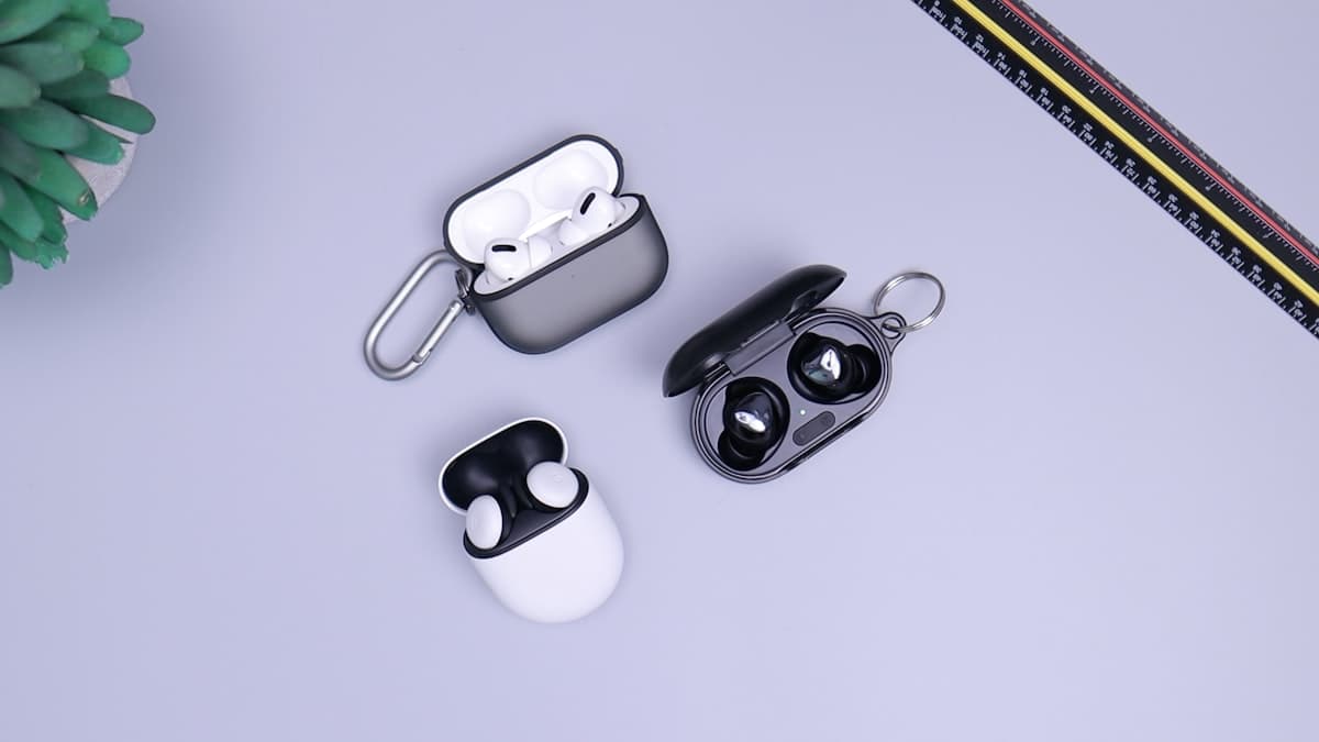 White wireless earbuds on light background representing OpenAI Sweetpea