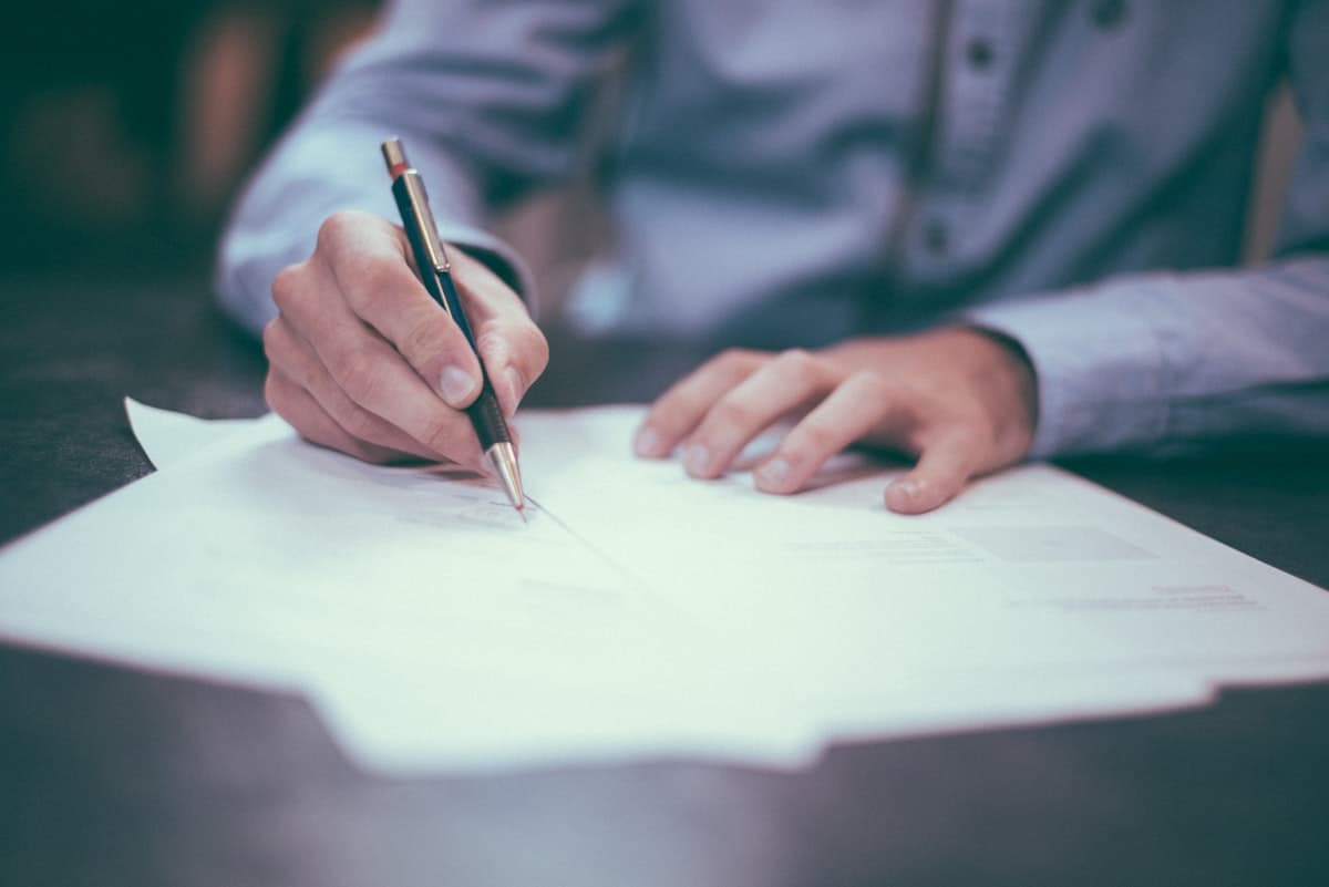 Calculator on financial documents representing rising SaaS subscription costs